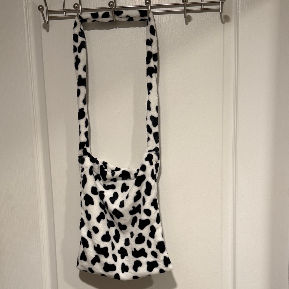 Cow print soft fun Women's crossbody or tote bag with Velcro closure.